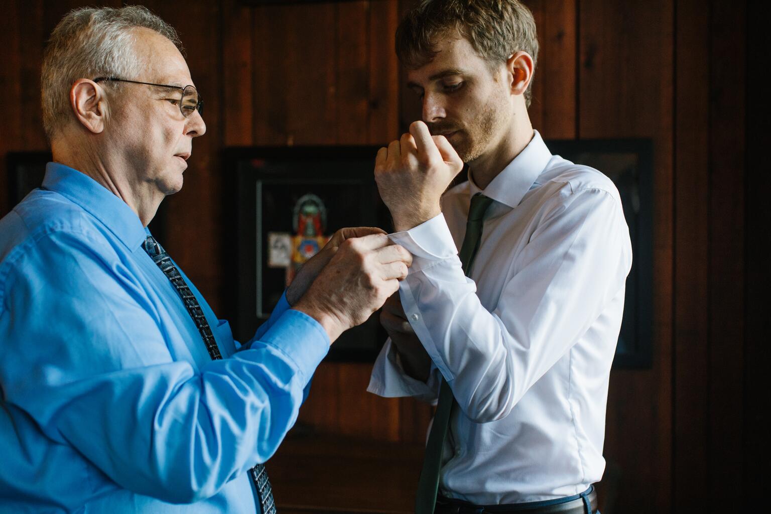 My dad helping with my cuff links